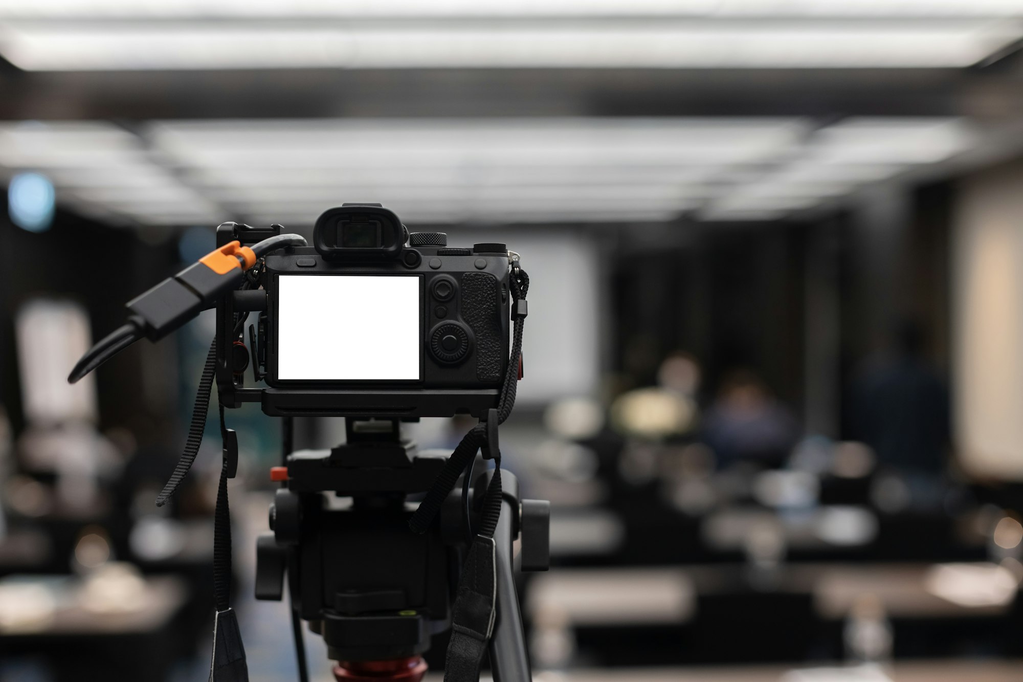 camera with white screen in news broadcast live studio.